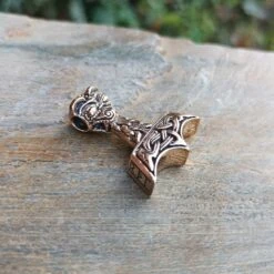Ferocious Beast Thors Hammer Pendant -The Viking Dragon ad ferocious beast thors hammer on rock bronze side view