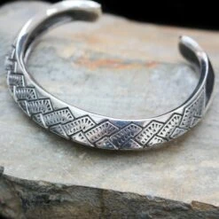 Silver Viking Axe Edge Arm Ring -The Viking Dragon ad silver axe armring on rock