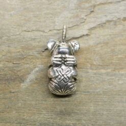 Gripping Bear Pendant -The Viking Dragon ad silver gripping bear pendant on rock back