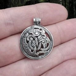 Round Dragon Beast Pendant -The Viking Dragon ad silver round gripping beast dragon pendant on hand