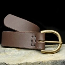 Leather Viking Belt With Brass Buckle -The Viking Dragon bt 32mm brown leather belt on rock