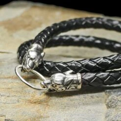 Braided Leather Necklace With Silver Ferocious Wolf Heads -The Viking Dragon bt 8mm width braided leather necklace silver ferocious wolf heads on rock