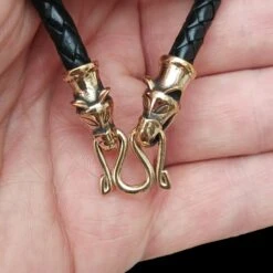 Braided Leather Necklace With Bronze Icelandic Wolf Heads 10 Braided Leather Necklace With Bronze Icelandic Wolf Heads -The Viking Dragon bt bronze 5mm braided leather necklace icelandic wolf heads split ring in hand