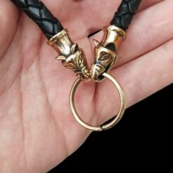 Braided Leather Necklace With Bronze Icelandic Wolf Heads 11 Braided Leather Necklace With Bronze Icelandic Wolf Heads -The Viking Dragon bt bronze 8mm braided leather necklace icelandic wolf heads split ring in hand