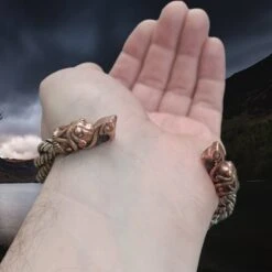 Handmade Twisted Bronze And Silver Arm Ring / Bracelet With Gotlandic Dragon Heads 8 Handmade Twisted Bronze And Silver Arm Ring / Bracelet With Gotlandic Dragon Heads -The Viking Dragon bt bronze and silver handmade twisted viking bracelet with gotland dragon heads on back of wrist