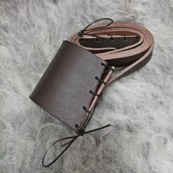 Handmade Leather Shoulder Strap For Viking Drinking / Blowing Horn -The Viking Dragon bt brown leather shoulder strap on wool rolled up