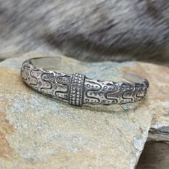 Silver Viking Bracelet From Falster -The Viking Dragon bt silver falster bracelet on rock