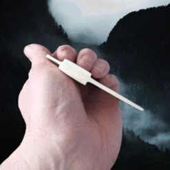 Rounded Bone Viking Comb -The Viking Dragon nc bone comb rounded in hand side view