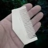 Triangular Bone Viking Comb -The Viking Dragon nc triangular bone comb on hand