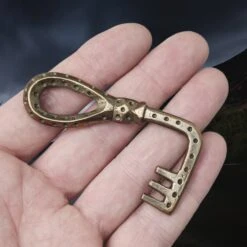 Large Bronze Viking Casket Key -The Viking Dragon pc bronze viking casket key other side on hand