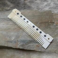 Medium Decorated Bone Viking Comb 11 Medium Decorated Bone Viking Comb -The Viking Dragon pm medium bone comb on rock