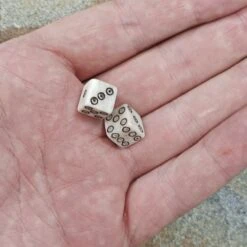 Small Bone Viking Dice With Dot And Ring Marks -The Viking Dragon pm small bone dice black dot and ring marks in hand x2