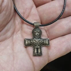 Bronze Crucifix Pendant -The Viking Dragon pp bronze crucifix pendant on thong on hand