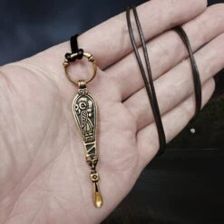 Bronze Ear Spoon Viking Pendant With Ring Hanger 8 Bronze Ear Spoon Viking Pendant With Ring Hanger -The Viking Dragon pp bronze earspoon pendant on hand on leather thong valkyrie side