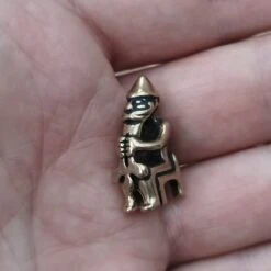 Bronze Seated Thor Pendant -The Viking Dragon pp bronze thor seated pendant in hand side angle view