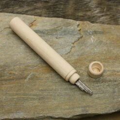 Wooden Viking / Medieval Needlecase -The Viking Dragon qs large wooden needle case on rock with needles