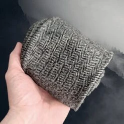 Herringbone Weave Wool Leg Wraps / Viking Winingas -The Viking Dragon ro wool herringbone dark grey leg wrap in hand front view