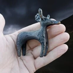 Bronze Age Scandinavian Bronze Bull / Reindeer Animal Statuette 10 Bronze Age Scandinavian Bronze Bull / Reindeer Animal Statuette -The Viking Dragon sg bronze age animal statuette in hand side view