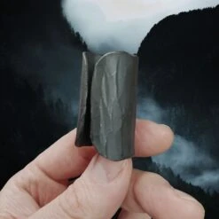 Iron Candle Holder -The Viking Dragon sg iron candle holder in fingers