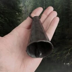 Hand-Forged Iron Viking Bell 8 Hand-Forged Iron Viking Bell -The Viking Dragon sg iron viking age bell in hand inside view