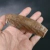 Decorated Wood Viking Comb With Curved Back 2 Decorated Wood Viking Comb With Curved Back -The Viking Dragon sg wooden deocrated viking comb on hand