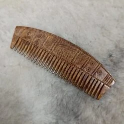 Decorated Wood Viking Comb With Curved Back -The Viking Dragon sg wooden deocrated viking comb on wool