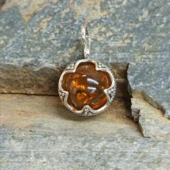 Silver Gotland Filigree Amber Ball Pendant 10 Silver Gotland Filigree Amber Ball Pendant -The Viking Dragon sn amber ball pendant on rock