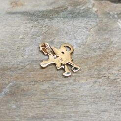 Bronze Fafnir Viking Pendant -The Viking Dragon sn bronze fafnir pendant on rock back angle view