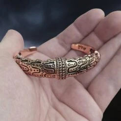 Danish Viking Bronze Bracelet From Falster -The Viking Dragon sn bronze falster bracelet in hand front view