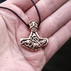 Bronze God Beast Thors Hammer Pendant 9 Bronze God Beast Thors Hammer Pendant -The Viking Dragon sn bronze godbeast thors hammer replica from norway on leather thong on hand