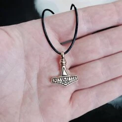 Small Bronze Gotland Replica Thors Hammer Pendant 9 Small Bronze Gotland Replica Thors Hammer Pendant -The Viking Dragon sn bronze gotland hammer small on hand front view
