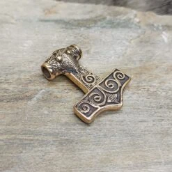 Bronze Filigree Thors Hammer Pendant From Kabara -The Viking Dragon sn bronze kabara thors hammer on rock front angle view