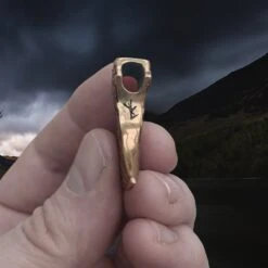 Bronze Knotwork Axe Head Pendant -The Viking Dragon sn bronze knotwork axehead pendant in hand side view