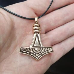 Large Bronze Gotland Replica Thors Hammer Pendant 10 Large Bronze Gotland Replica Thors Hammer Pendant -The Viking Dragon sn bronze large gotland hammer front on hand on leather thong