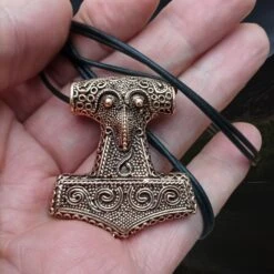 Large Bronze Skåne Thors Hammer Pendant -The Viking Dragon sn bronze large skane hammer on hand on leather thong wrapped around hand