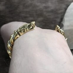 Twisted Bronze And Silver Bracelet With Gotlandic Dragon Heads -The Viking Dragon sn bronze silver twisted bracelet gotland dragon heads on back wrist
