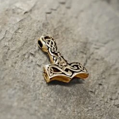 Small Bronze Interlace Thors Hammer Pendant -The Viking Dragon sn bronze small interlace hammer on rock angle view