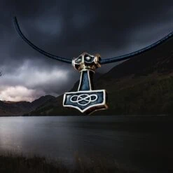 Small Bronze Thunder Thors Hammer Pendant 11 Small Bronze Thunder Thors Hammer Pendant -The Viking Dragon sn bronze small thunder hammer viking pendant on leather thong angle view