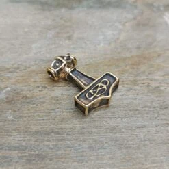 Small Bronze Thunder Thors Hammer Pendant 12 Small Bronze Thunder Thors Hammer Pendant -The Viking Dragon sn bronze small thunder thors hammer on rock front angle view