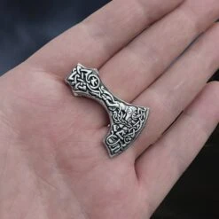 Silver Bearded Axe Head Pendant -The Viking Dragon sn silver bearded axe head pendant on hand slight angle view