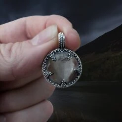 Medium Silver Gotland Crystal Lens Pendant -The Viking Dragon sn silver crystal lens pendant medium 20mm in fingers