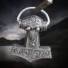 Silver Filigree Thors Hammer Pendant Replica From Kabara -The Viking Dragon sn silver filigree thors hammer from kabara hanging dark background
