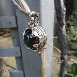 Small Silver Gotland Onyx Ball Pendant -The Viking Dragon sn silver gotland onyx ball pendant in tree angle view