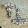 Silver Gotland Replica Thors Hammer Pendant -The Viking Dragon sn silver gotland thors hammers front and back on rock