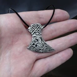 Silver Knotwork Viking Axe Head Pendant -The Viking Dragon sn silver knotwork axehead pendant on leather thong on hand