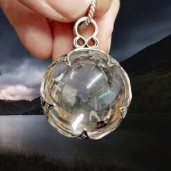 Large Silver Gotland Crystal Ball Pendant -The Viking Dragon sn silver large gotland crystal ball pendant in fingers front view