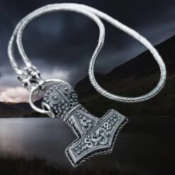Slim Silver Snake Chain Necklace With Tromso Dragon Heads -The Viking Dragon sn silver oland thors hammer on split ring with tromso dragon head snake chain angle view