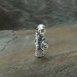 Small Silver Valkyrie Pendant 8 Small Silver Valkyrie Pendant -The Viking Dragon sn silver small valkyrie pendant on rock front view