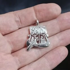 Silver Gotland Viking Stone Ship Pendant 9 Silver Gotland Viking Stone Ship Pendant -The Viking Dragon sn silver viking stone ship pendant on hand