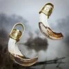 Brass Capped Boar Tusk Pendant 2 Brass Capped Boar Tusk Pendant -The Viking Dragon tc large boar tooth pendants with embossed brass hangers cloudy background